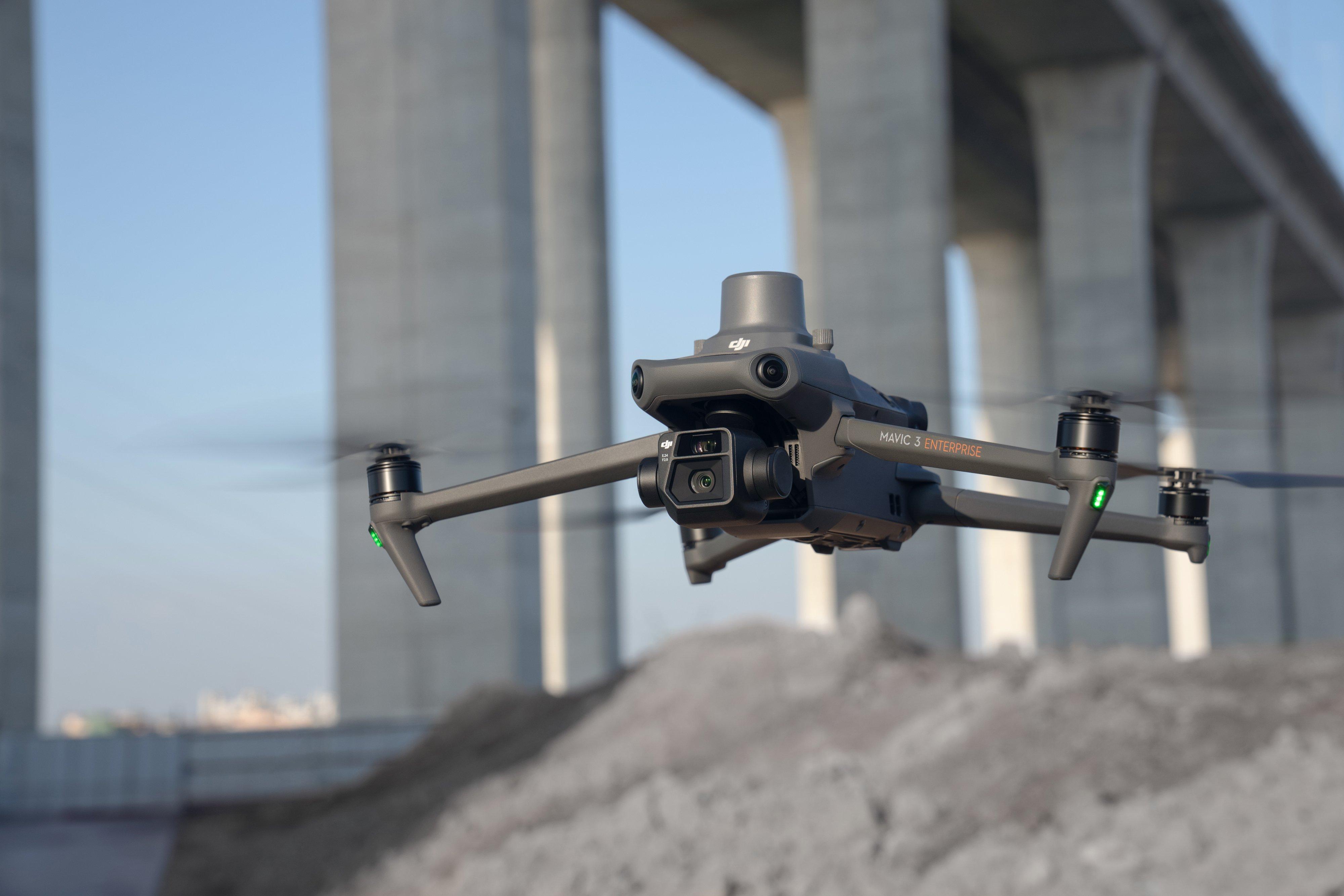 DJI drone hovering next to a structure